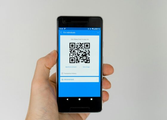 Smartphone scanning a payment QR code