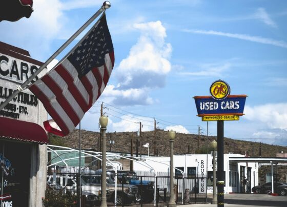 Cars and signage at an outdoor vehicle dealership