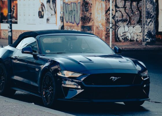 Dark Ford Mustang parked outdoors
