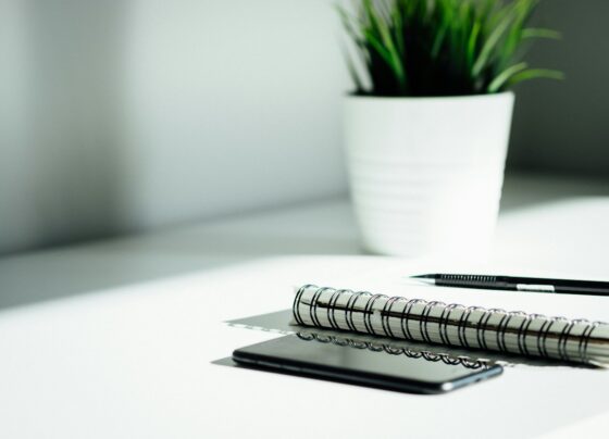 Notebook and writing tools arranged for planning
