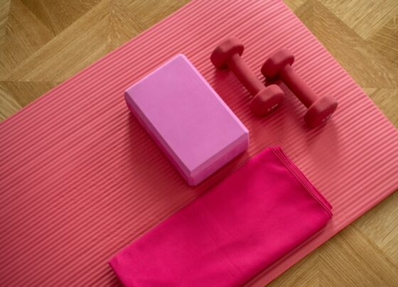 Pink exercise mat with small weights