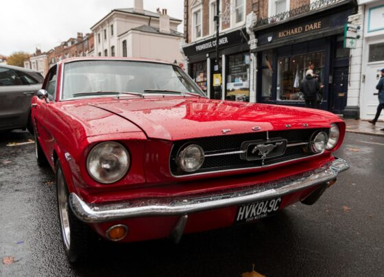 Classic red Ford Mustang parked on a street