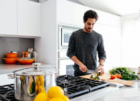 Person preparing vegetables in a kitchen