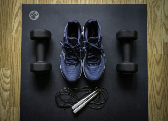 Home workout equipment with dumbbells and athletic shoes