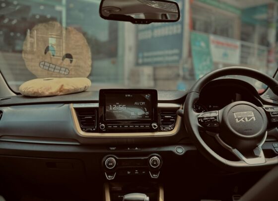Interior of a car with a steering wheel and center console