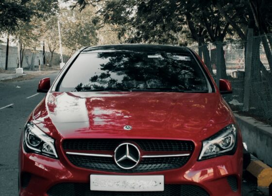 Red Mercedes-Benz car parked on a street