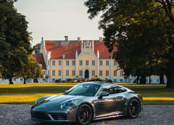 Porsche sports car parked on a country road