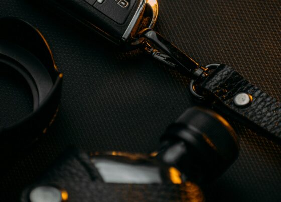 Car key fob and keys resting on a dark surface