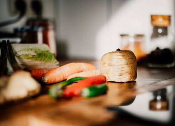 Sliced vegetables on a wooden chopping board