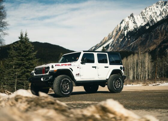 White Jeep Wrangler on a mountain road