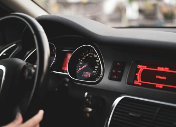 Close-up of steering wheel and dashboard gauges