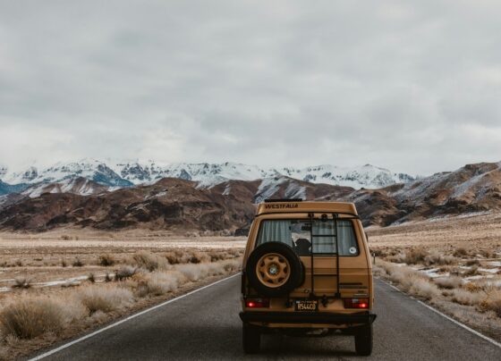 Van parked along a mountain road
