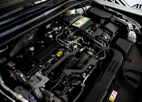 Engine bay beneath an open car hood