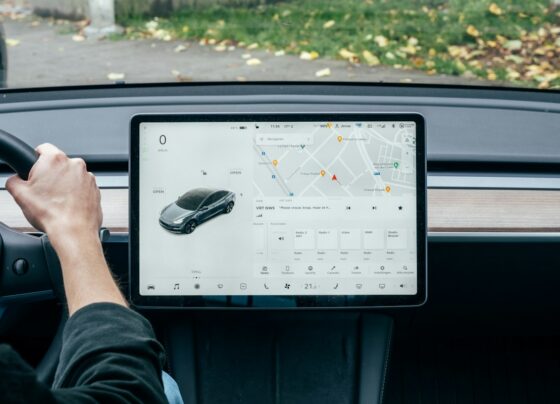 Driver beside a large vehicle touchscreen