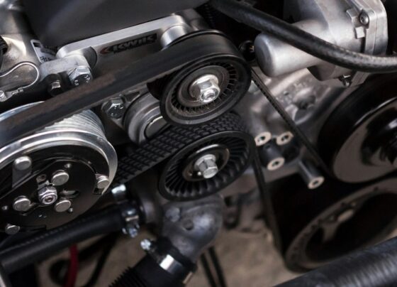 Engine belts and pulleys inside a car