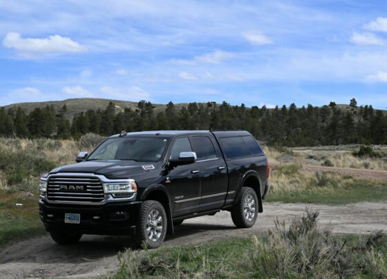 Dark Ram pickup truck parked in an open landscape